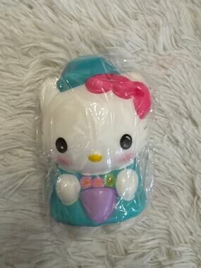 Hello Kitty foam squishy slow rebound pink bow and floral design on teal dress